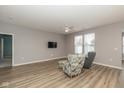 Bright living room featuring wood floors, recessed lighting, and comfortable seating with large windows at 1468 Lexington Trl, Greenfield, IN 46140