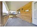 View of the front porch with natural wood features at 1511 E Tabor St, Indianapolis, IN 46203