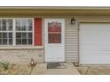Welcoming front entrance featuring a classic white door, decorative shutters, and an inviting welcome mat at 1517 Citation N Cir, Lebanon, IN 46052