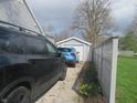 Detached garage and parking area, providing ample space for vehicles and outdoor storage at 2012 N Janney Ave, Muncie, IN 47304