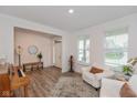 Cozy living room with natural light, stylish rug, and comfortable seating at 2208 Dudley Ave, Westfield, IN 46074