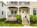Inviting front entrance with a white door, lovely wreath, and well-maintained landscaping at 2316 N Pennsylvania St # 1, Indianapolis, IN 46205