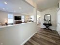 Inviting foyer with wood floors, light walls, and an open view of the living room, dining area, and kitchen at 2419 N Park Ave, Indianapolis, IN 46205