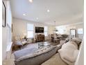 Bright and airy living room open to the dining area and kitchen, featuring comfortable seating and ample natural light at 2419 N Park Ave, Indianapolis, IN 46205