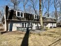This home features a spacious backyard with a wooden deck, perfect for outdoor entertaining at 2605 W Berkshire Dr, Muncie, IN 47304