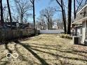 A spacious, fenced backyard ready for outdoor activities and relaxation at 2605 W Berkshire Dr, Muncie, IN 47304