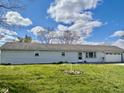 Charming single-story home with light siding, a attached garage, and a neatly kept lawn at 2715 S 300 E, Anderson, IN 46017