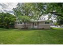 A well-maintained ranch-style home with a lush green lawn and established landscaping at 3140 Bonham Dr, Indianapolis, IN 46222