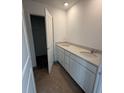 Modern bathroom features a double vanity with white cabinets and stone countertops at 3315 Godby Dr, Sheridan, IN 46069