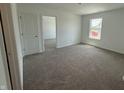 Comfortable carpeted bedroom with a window providing natural light at 3315 Godby Dr, Sheridan, IN 46069
