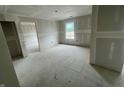 Spacious room with natural light and a neutral color scheme; walls are prepped for paint at 3315 Godby Dr, Sheridan, IN 46069