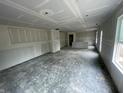Large unfinished living space featuring ample room for furniture and natural light from large windows at 3315 Godby Dr, Sheridan, IN 46069