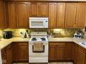Well-equipped kitchen with modern appliances, ample counter space, and stylish cabinets at 4871 Franklin Villas Dr, Indianapolis, IN 46237