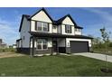 Charming two-story home with black trim, a gray garage door, and a well-manicured front yard at 5692 Coulter Way, Greenwood, IN 46143