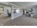 Spacious living room with neutral tones and a view into the dining area, perfect for entertaining and relaxation at 6613 Harvest Ridge Ct, Indianapolis, IN 46237