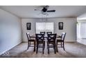 Well-lit dining room with a wooden table and six chairs, perfect for Gathering gatherings at 729 Stonehenge Way, Brownsburg, IN 46112