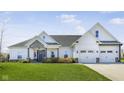 Beautiful single-Gathering home with well-kept lawn and a welcoming front entry at 978 S Fairway Village Ct, Greenfield, IN 46140