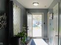Welcoming foyer with neutral walls, bright lighting, and decorative plants, creating a warm ambiance at 1139 Topp Creek Dr, Indianapolis, IN 46214