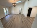 Bright living room featuring vaulted ceilings, skylights, and modern lighting fixtures at 1348 Secretariat Ln, Indianapolis, IN 46217