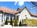 View of the home featuring yellow patio and red/brown tiled roof at 2025 Barth Ave, Indianapolis, IN 46203