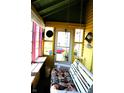Inviting sunroom offering a serene space with colorful cushions at 2025 Barth Ave, Indianapolis, IN 46203