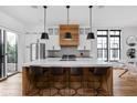 Modern kitchen with a large center island, stylish barstools, stainless steel appliances, and ample counter space at 2134 N New Jersey St, Indianapolis, IN 46202