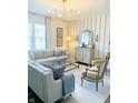 Bright living room with plush seating, elegant decor, and a modern chandelier at 2250 Egbert Rd, Westfield, IN 46074