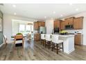 Open concept kitchen featuring stainless steel appliances, a large island, and breakfast nook at 261 Onset Way, Westfield, IN 46074