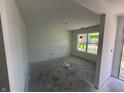 Unfinished room featuring neutral walls, a window and an open doorway creating flow at 3297 Godby Dr, Sheridan, IN 46069