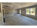 Bright living room with large window and drywall ready for paint at 3309 Godby Dr, Sheridan, IN 46069