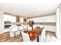 Bright kitchen features a large island, updated appliances, and seamless dining space at 3650 Tipperlin Rd, Bargersville, IN 46106