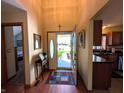 Bright foyer featuring hardwood floors and an open view to the kitchen at 3730 Cheyenne Ct, Columbus, IN 47203