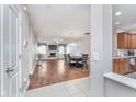 Open-concept living area features a fireplace, hardwood floors, and adjacent dining space at 4280 Zachary Ln, Westfield, IN 46062