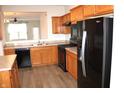 Well-equipped kitchen featuring stainless steel appliances and wood cabinets at 5069 Lilium Dr, Plainfield, IN 46168
