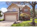 Charming two-story home features brick and siding, a two-car garage, and a well-maintained front lawn at 5343 Ripplingbrook Way, Carmel, IN 46033