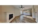 Bright living room featuring a cozy fireplace, hardwood floors, and a spacious open layout perfect for entertaining at 6508 Pergola Ln, Indianapolis, IN 46241