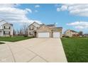 Lovely exterior of a home boasting a spacious driveway and well-kept lawn at 6707 Meadow View Ct, Avon, IN 46123