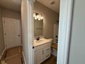 Well-lit bathroom featuring a single vanity with a white countertop and white cabinets at 7421 Broadview Ln, McCordsville, IN 46055