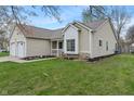 Inviting home with manicured landscaping, showcasing its charming curb appeal and well-kept exterior at 8747 Knotty Pine Ct, Indianapolis, IN 46227