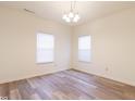 Bright bedroom with wood floors, neutral walls, and large windows that provide a comfortable living space at 904 Adena Ln, Westfield, IN 46074