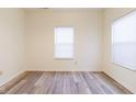 Neutral-toned bedroom with wood floors, large windows, and ample natural light, creating a serene atmosphere at 904 Adena Ln, Westfield, IN 46074