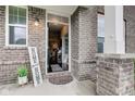 Warm entryway featuring a welcoming sign and a glimpse of the interior at 10602 Pintail Ln, Indianapolis, IN 46239