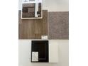 Interior material selections featuring brick, carpet, vinyl flooring, and kitchen cabinetry at 1147 Stubble Run, Danville, IN 46122