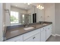 Modern bathroom featuring double vanity, granite countertops, and walk-in shower at 13316 E Lieder Way, Fishers, IN 46037