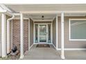 Inviting front entrance with a decorative storm door and a neutral color scheme at 1417 Macintosh Ct, Avon, IN 46123