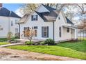 Quaint two-story home featuring classic architecture, complemented by a neat lawn and inviting curb appeal at 143 W Washington St, Mooresville, IN 46158