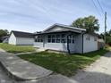 Inviting single-story home with a quaint covered porch, vinyl siding, and a well-kept lawn at 1546 Kappes St, Indianapolis, IN 46221