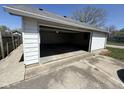 Spacious detached garage featuring an open overhead door and a concrete driveway at 1546 Kappes St, Indianapolis, IN 46221