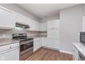 Bright kitchen with white cabinets, stainless steel appliances, and granite countertops provides a welcoming atmosphere at 1616 Capra Ct, Beech Grove, IN 46107