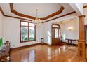 Elegant foyer with hardwood floors, ornate chandelier, and a grand wooden front door at 1853 Water Oak Ct, Avon, IN 46123